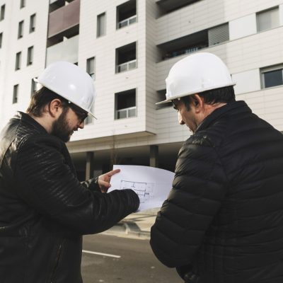 draftsmen-discussing-blueprints
